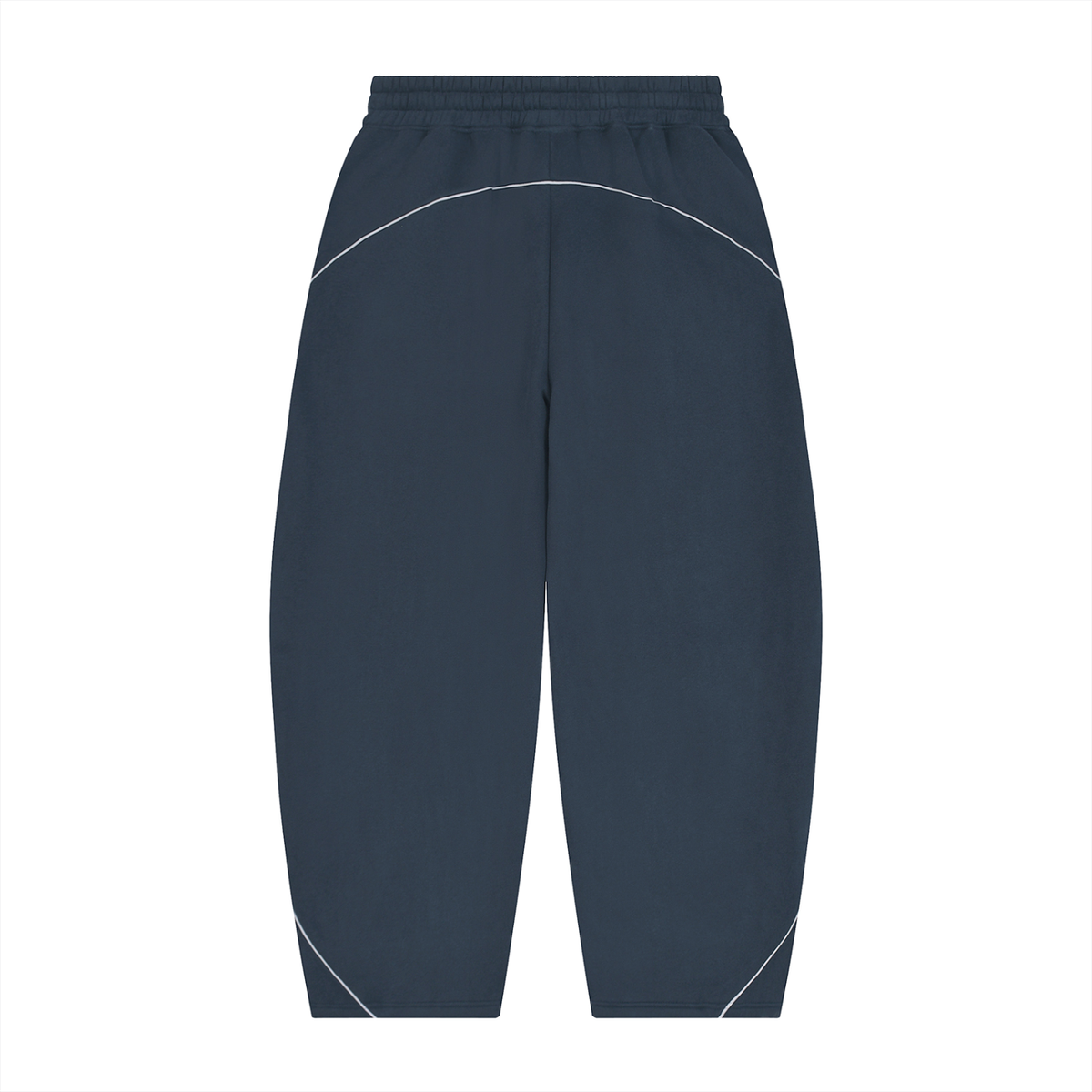 A pair of dark slate blue athletic pants with white curved contrast stitching details, shown flat against a solid white background.