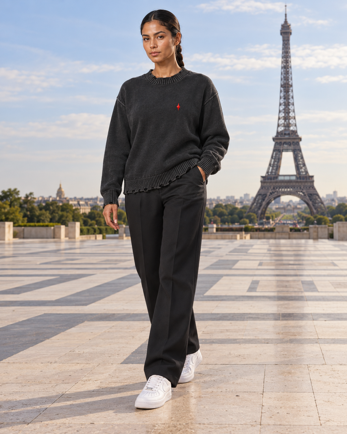 Female model wearing TLOL Black frayed sweater at Trocadéro, Paris