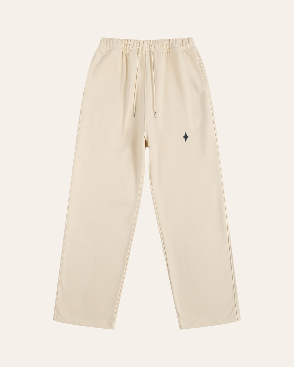 TLOL RELEASE Bone pants, product front on light beige. Hoodie and pants sold separately.