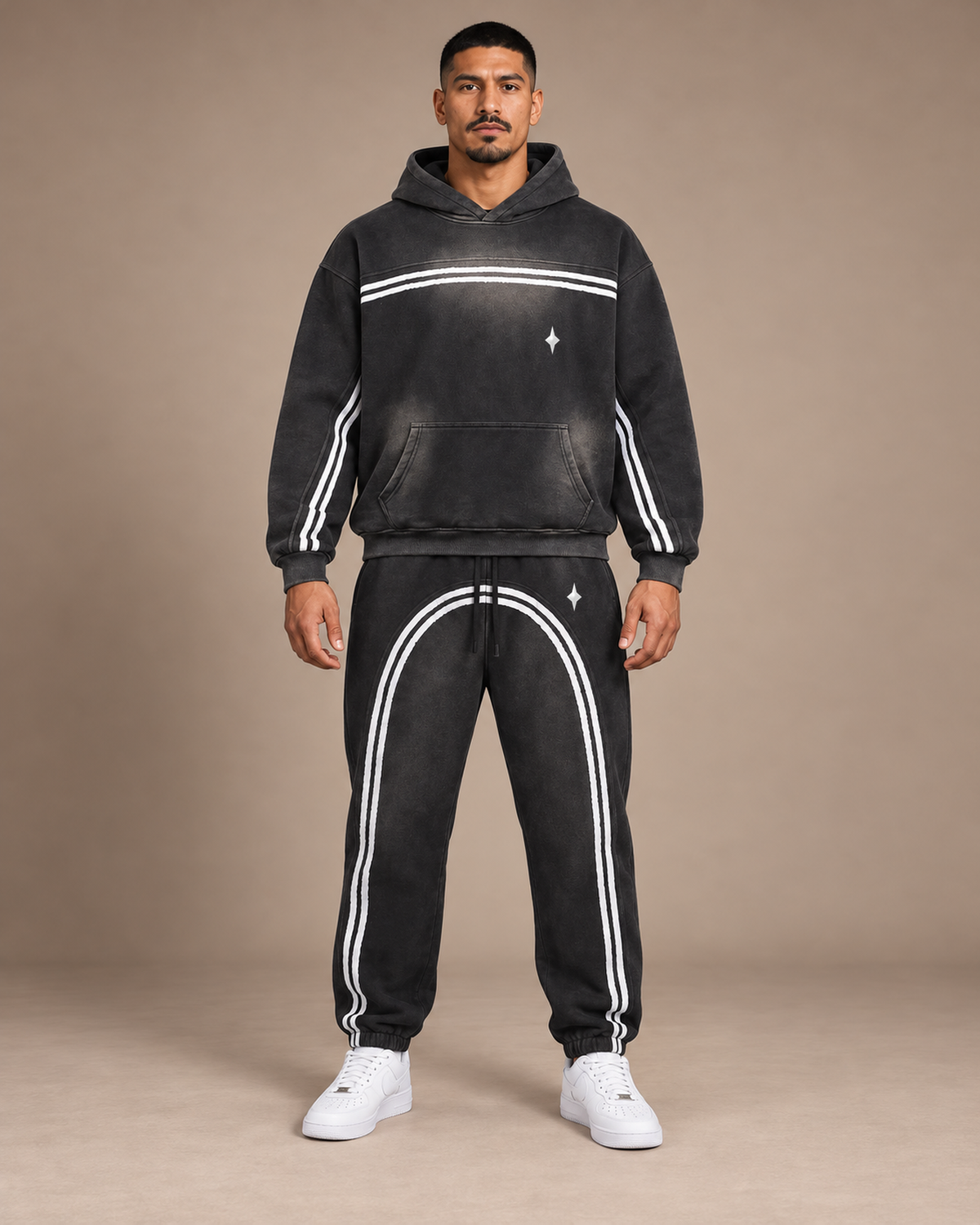 Male model wearing the black TLOL Threshold sunfade contrast hoodie and matching joggers, front view