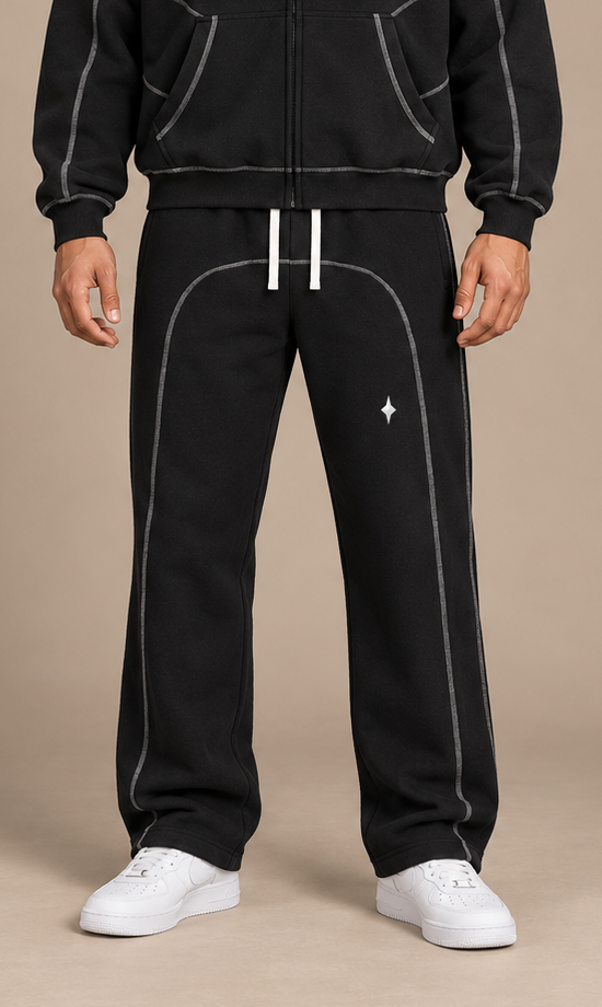 Black TLOL contrast-stitched fleece pants, close on-body model view #Color_black