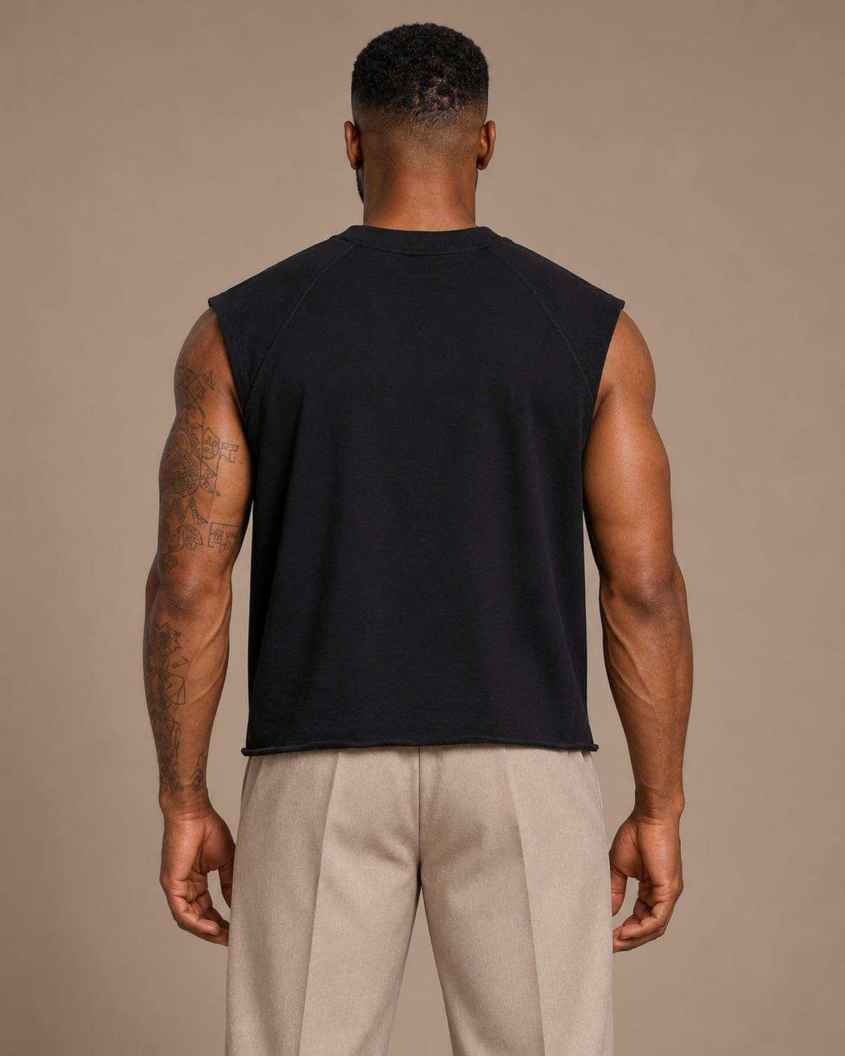 TLOL Boxy Raw-Hem Tank in Black on model, back view.