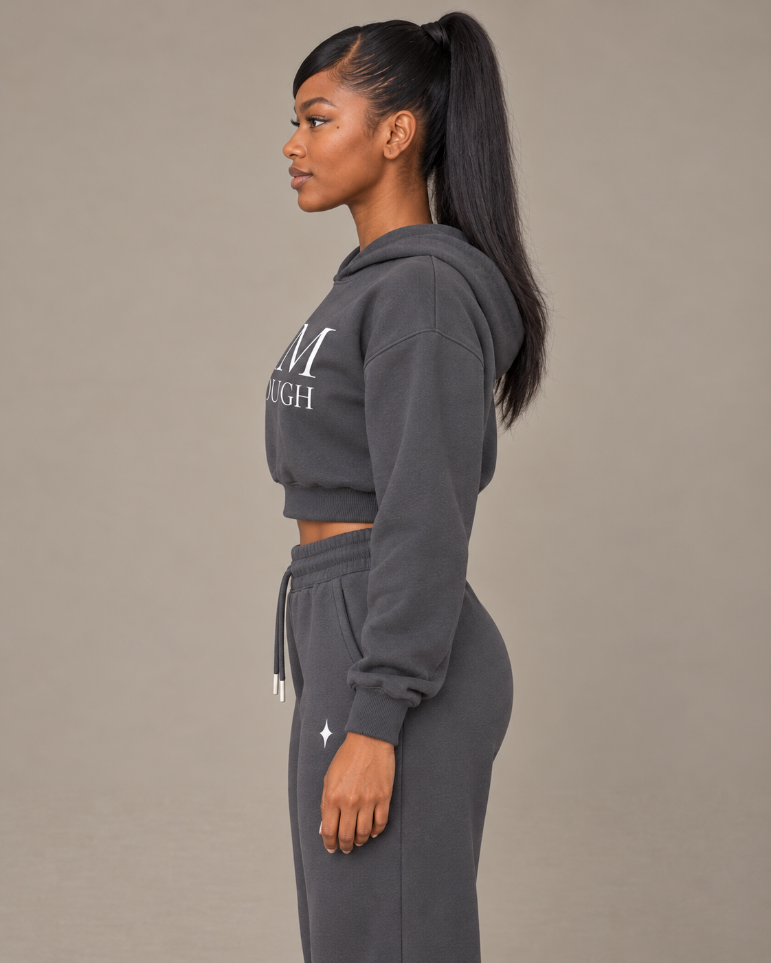 TLOL I AM ENOUGH Weighted Pillar cropped hoodie in Charcoal Gray, wearer-left side view