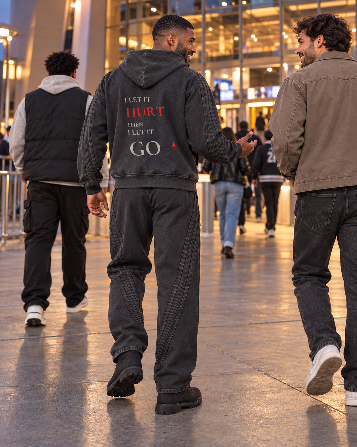 TLOL Release Black zip hoodie matching outfit, lifestyle view. Hoodie and pants sold separately.