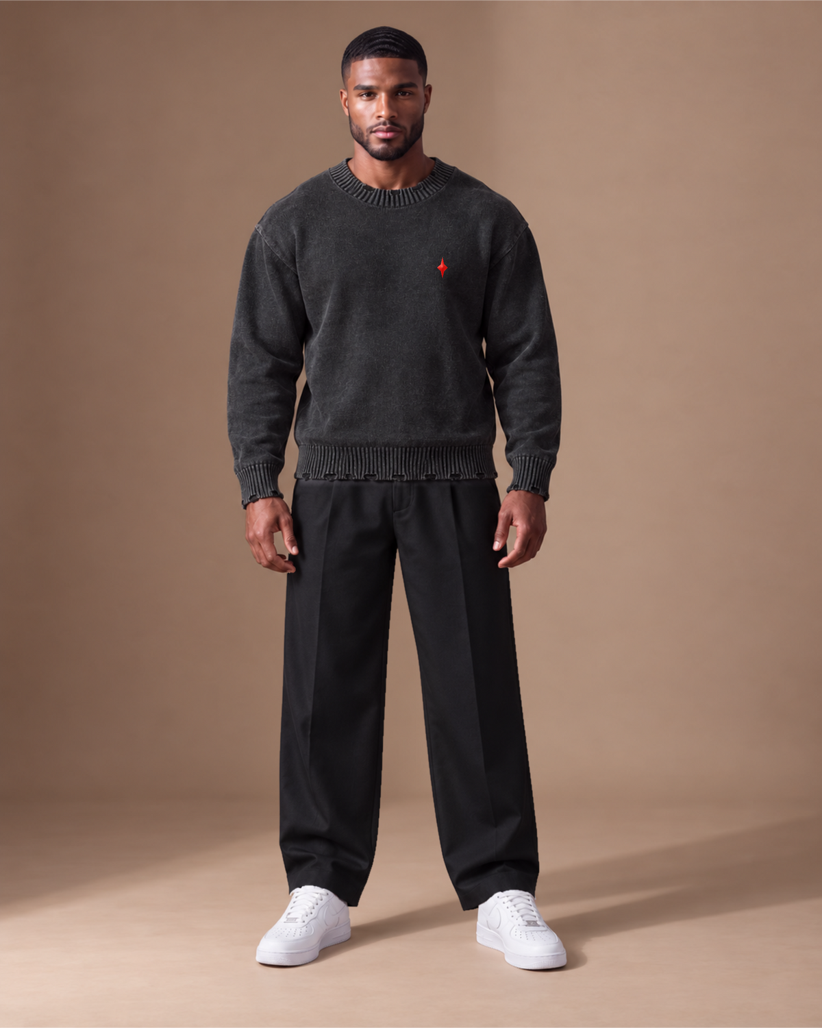 Male model wearing TLOL Black red icon frayed sweater, front