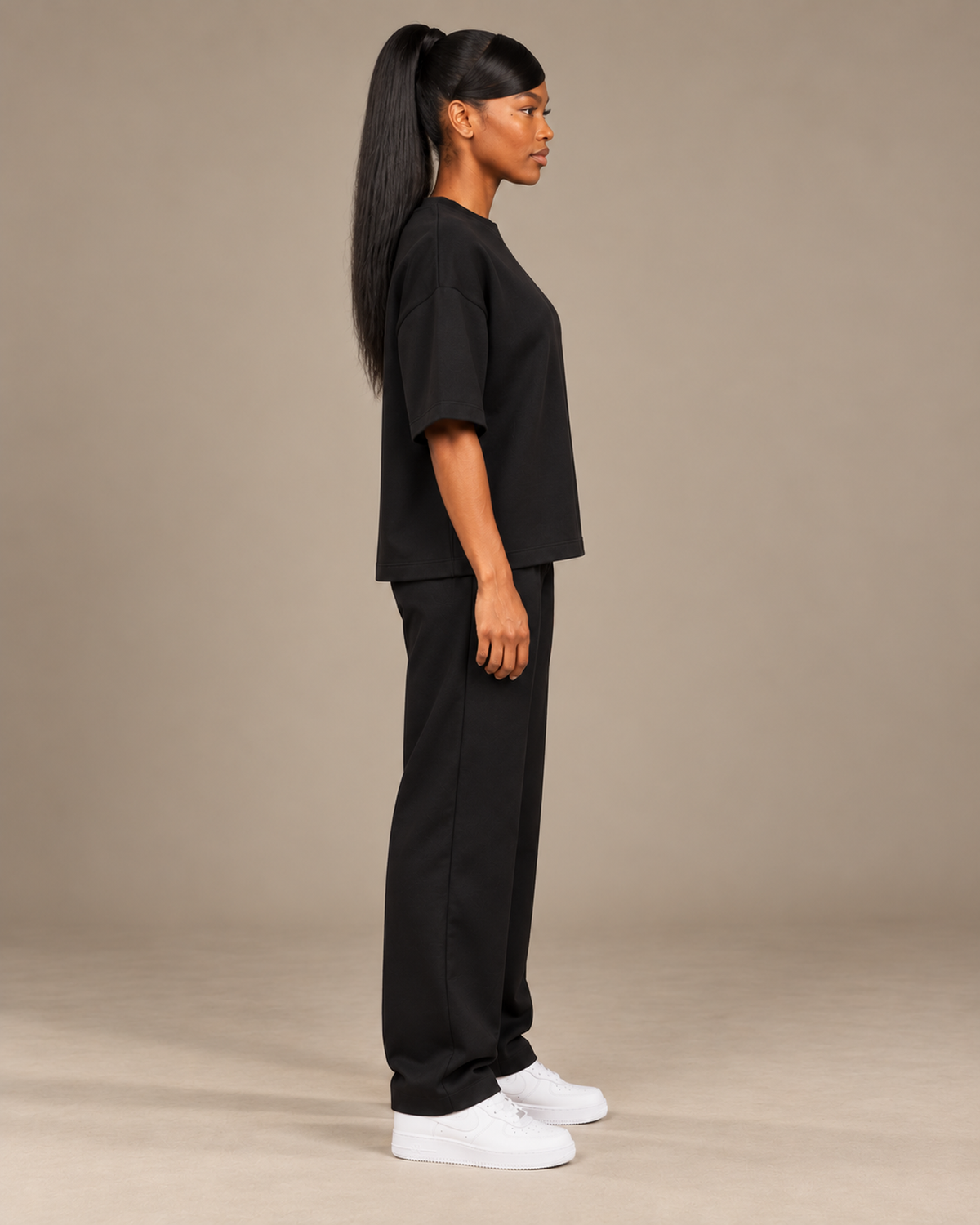 TLOL Lightwell oversized tee in Black, right-facing side view on a model.