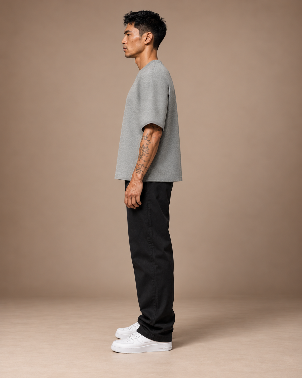 TLOL Lightwell oversized tee in Flower Gray, left-facing side view on a model.