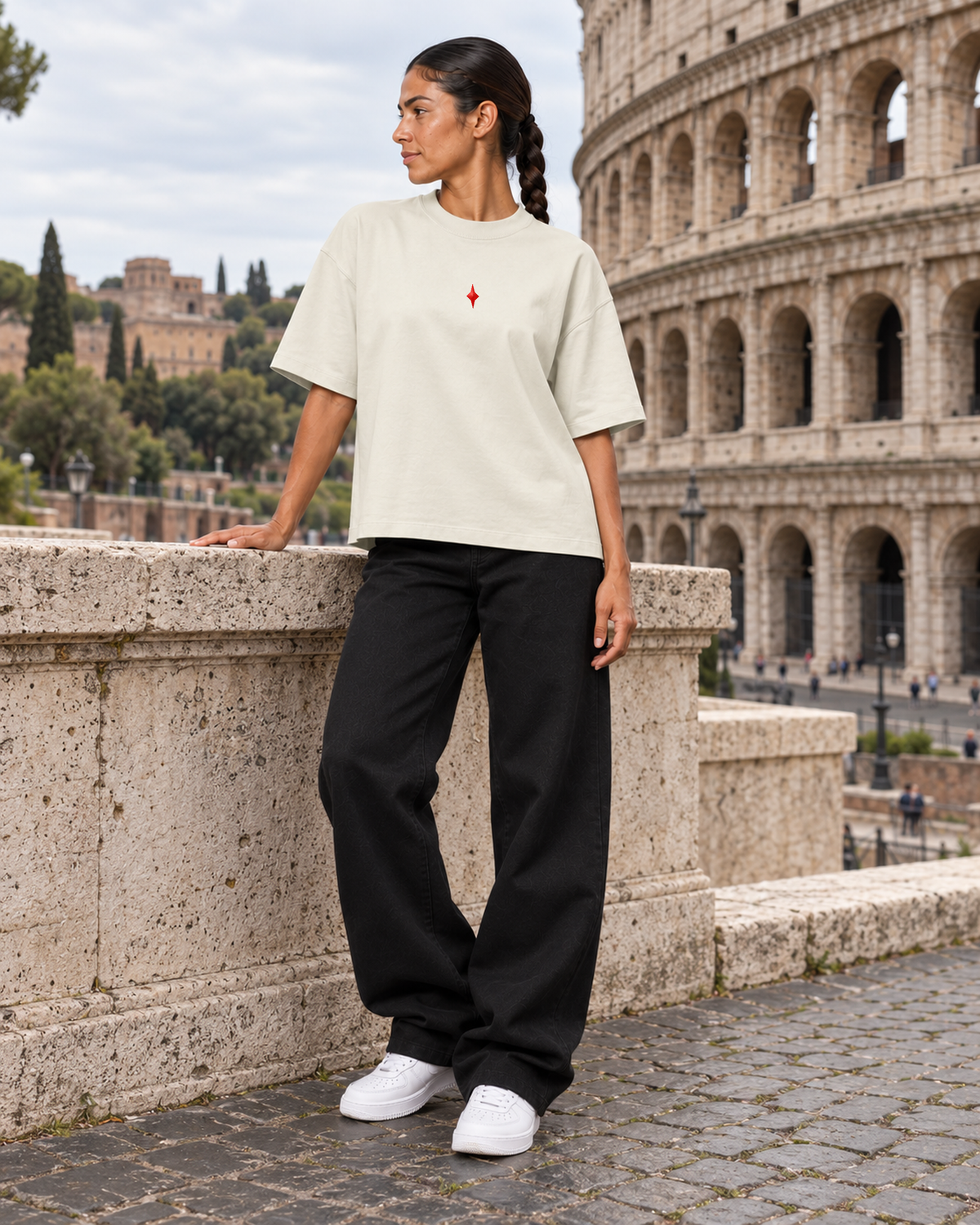 TLOL Lightwell oversized tee in Gray, model styled with black trousers in a Rome-inspired scene.
