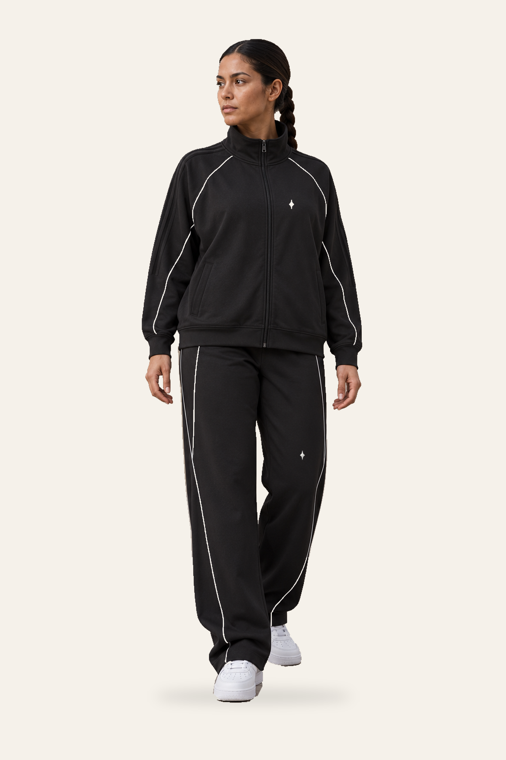 TLOL REFLECTION Black pants, editorial on light beige. Jacket and pants sold separately.