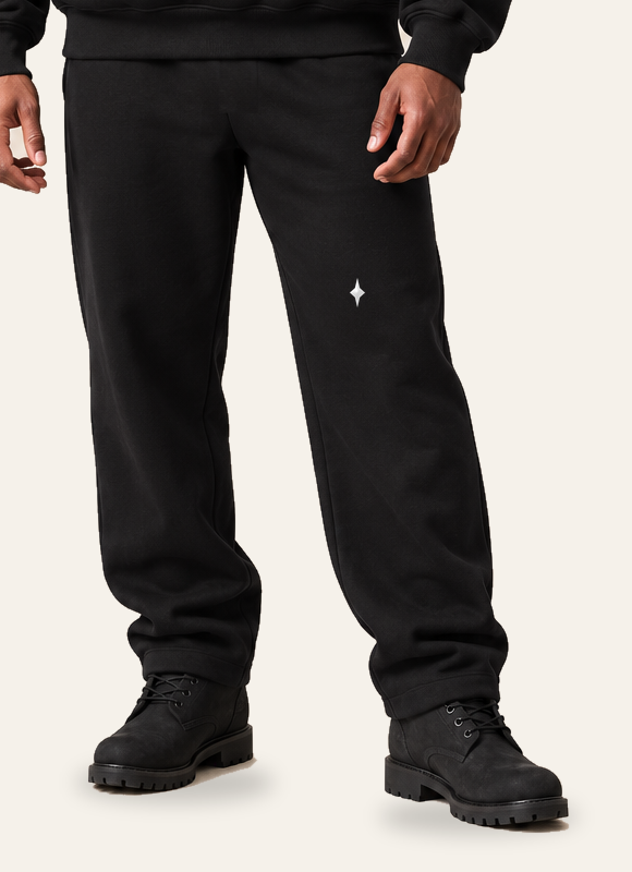 TLOL RELEASE Black Beauty pants, waist through shoes on light beige. Hoodie and pants sold separately.