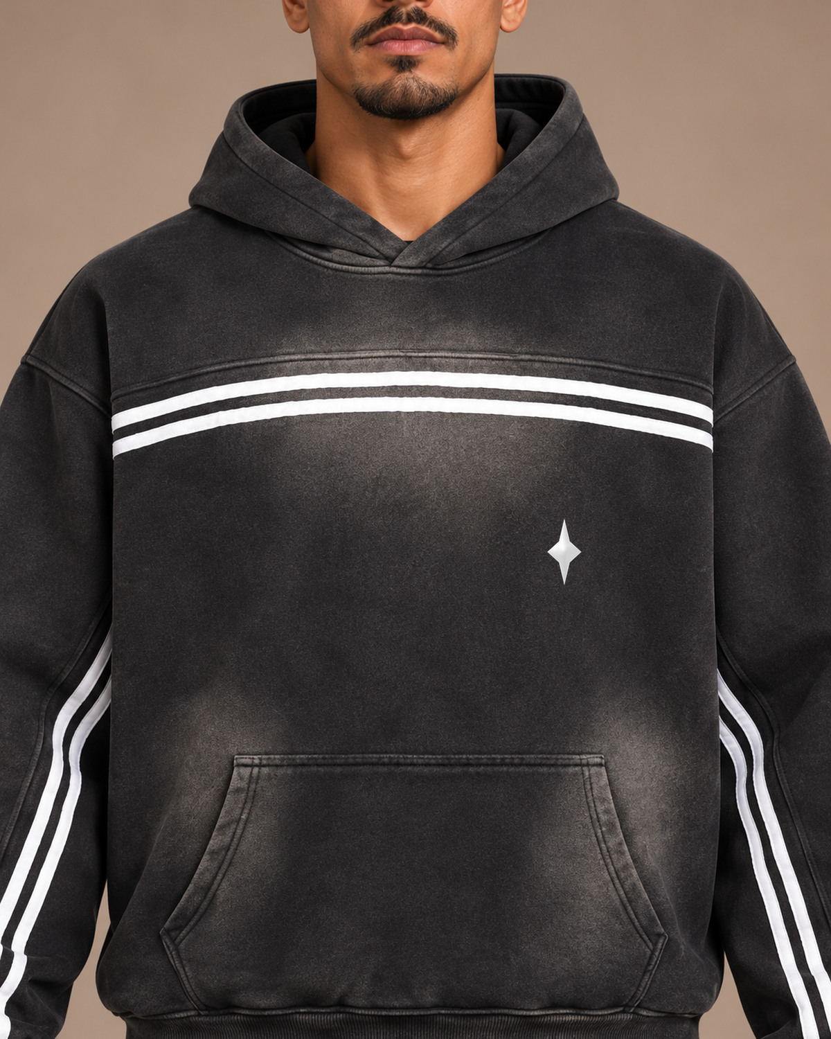 Close view of the black TLOL Threshold hoodie, contrast chest tape and white icon