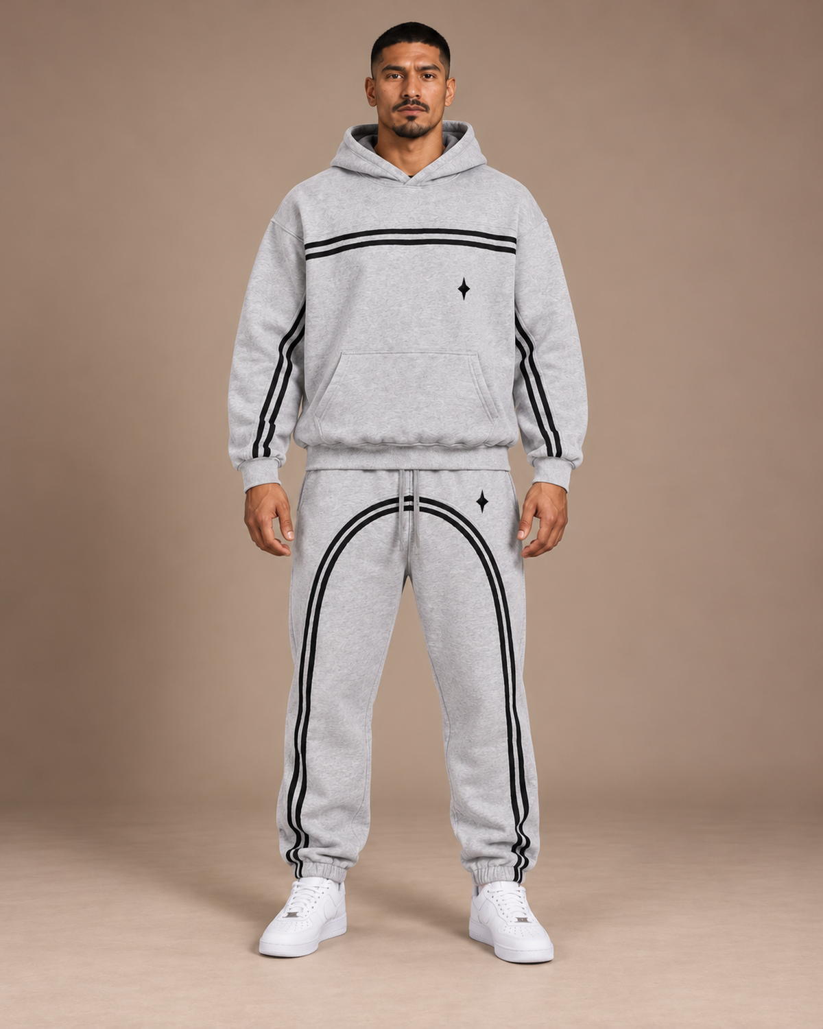 Male model wearing the Flower Gray TLOL Threshold hoodie and matching joggers, front view