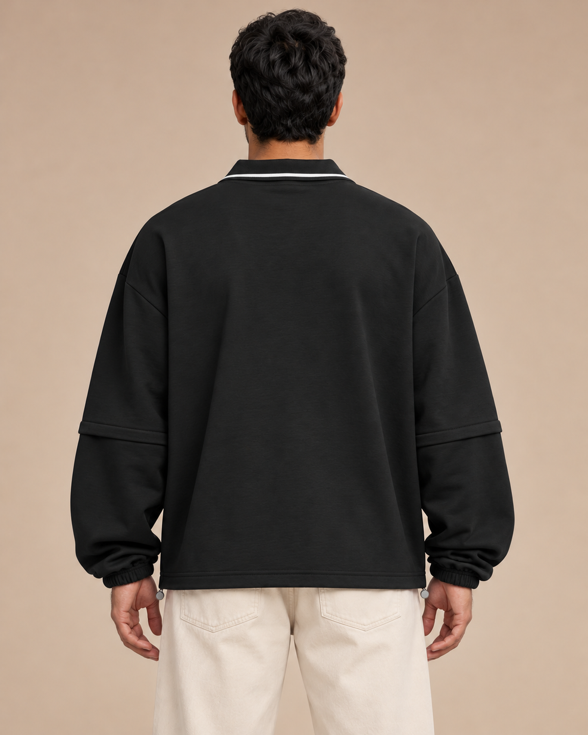 Model wearing the Black TLOL Collared Detachable Sweatshirt, fully assembled back view.