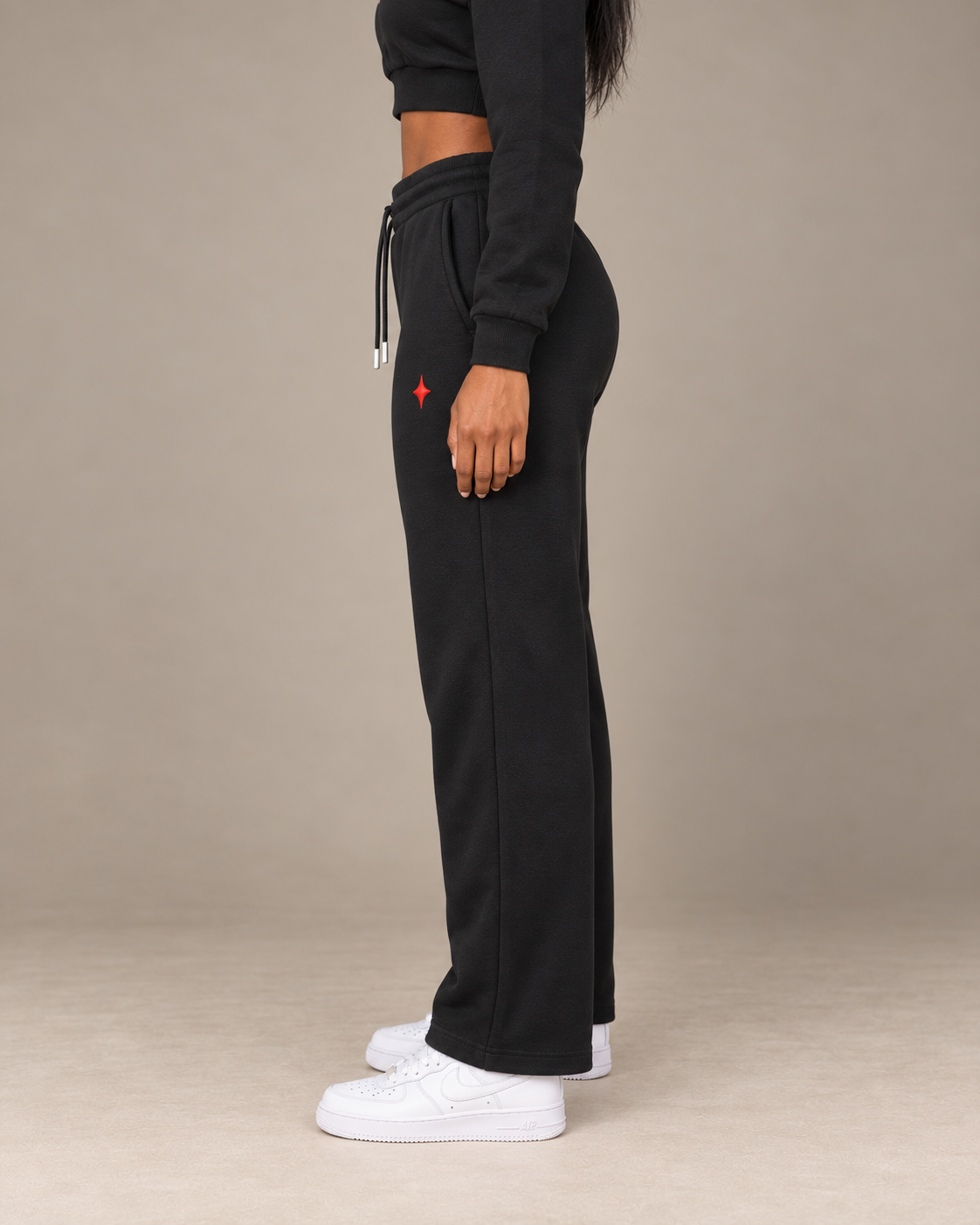TLOL I AM ENOUGH Weighted Pillar straight-leg sweatpants in Black, wearer-left side view