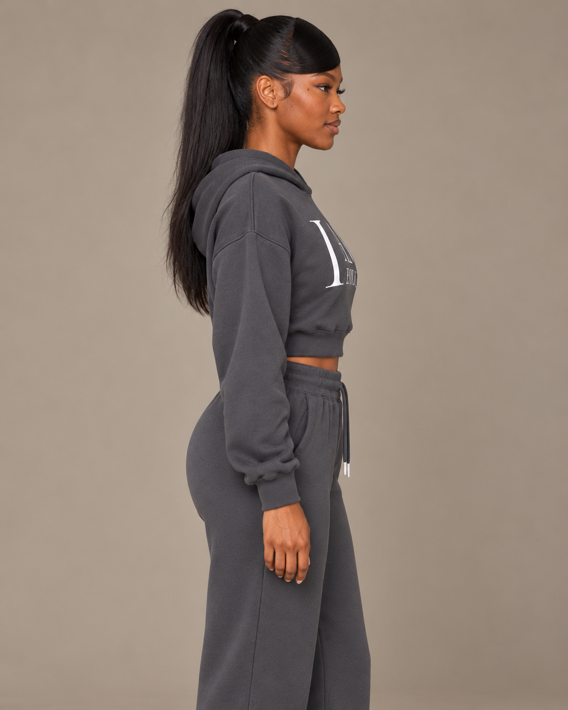 TLOL I AM ENOUGH Weighted Pillar cropped hoodie in Charcoal Gray, wearer-right side view